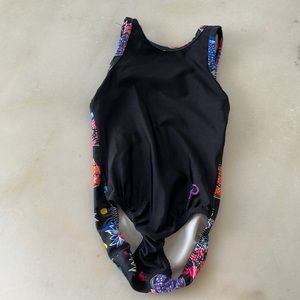 This is a strawberry flip-side leotard from Plum Practice wear.